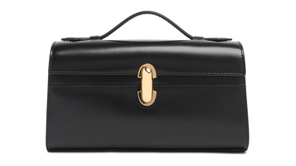 The Savette Symmetry Bag in Black leather with top handle and gold hardware