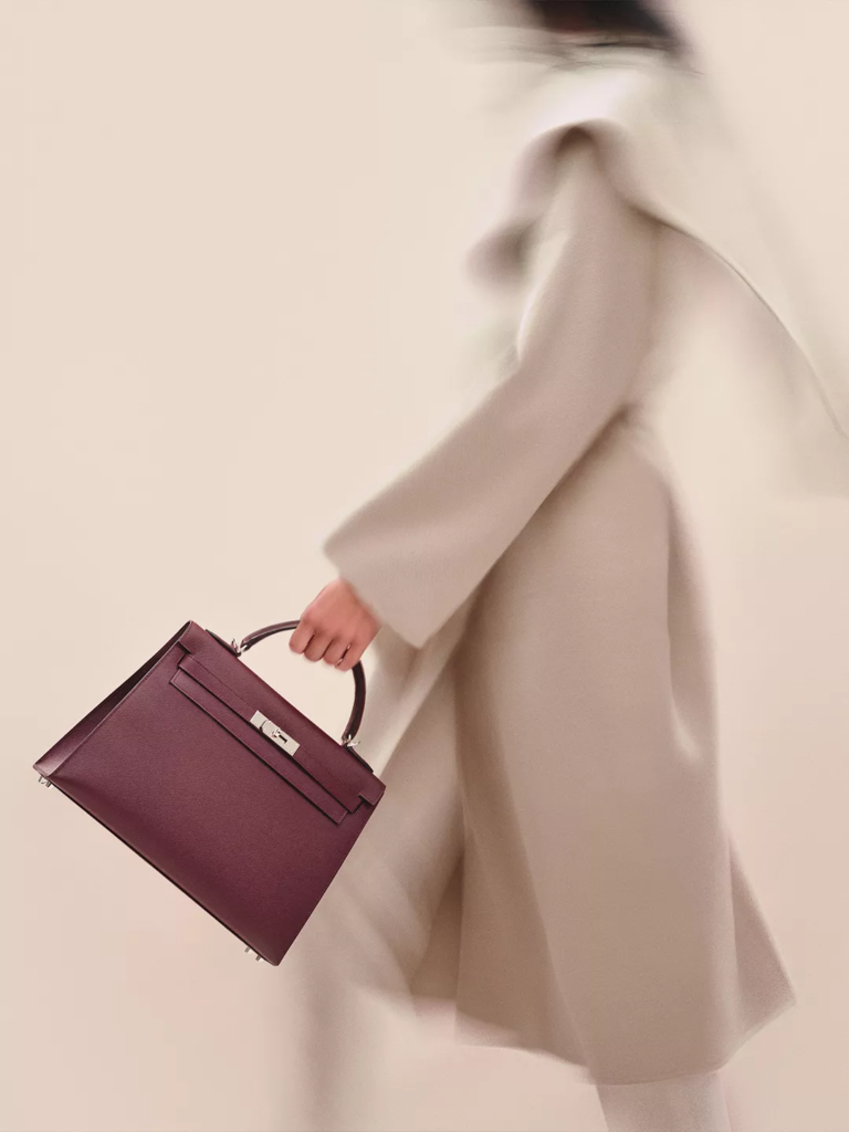 The Hermès Kelly Bag in Burgundy and gold hardware